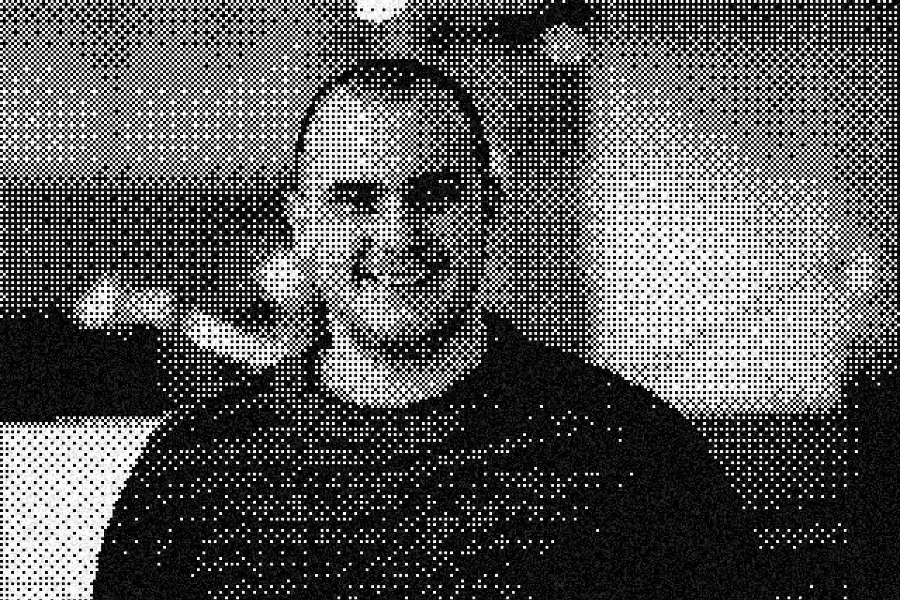 Black-and-white halftone portrait of Alex Karavaev